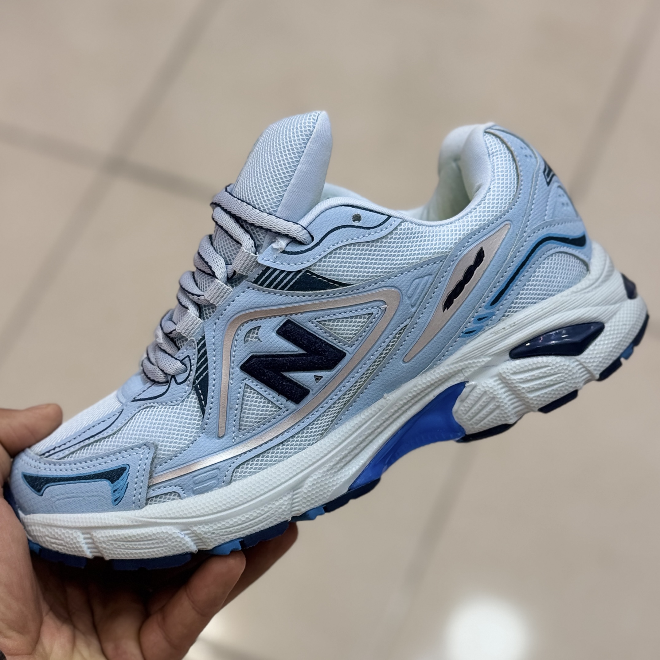 نیوبالانس 1064 زنانه و مردانه زیره تیکه خورده آبی روشن